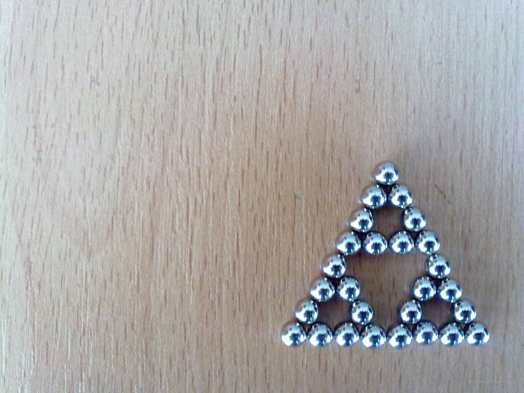 Magnetic balls forming a triangle