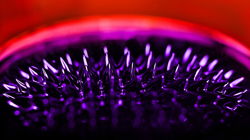 Magnetic spikes under purple light