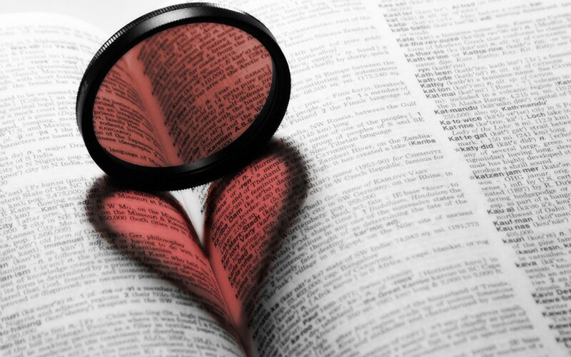 Magnifying Glass on Book — Black, Focused