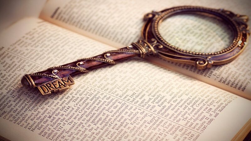Magnifying Glass on Book — Brown