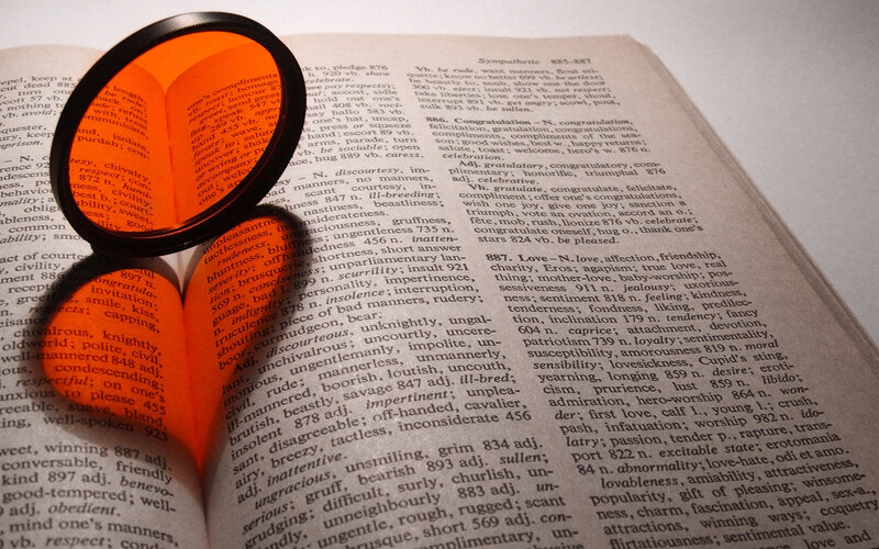 magnifying glass on dictionary