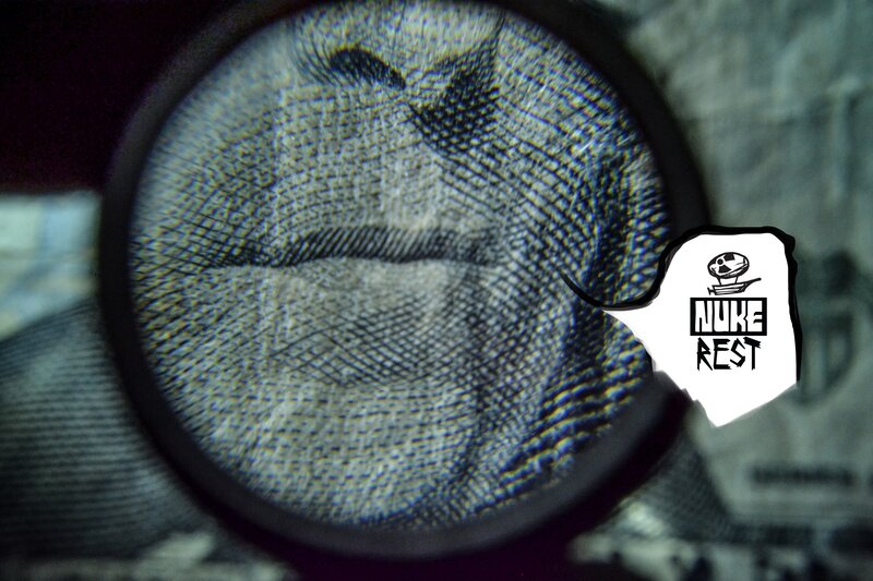 Magnifying Glass on Dollar Bill