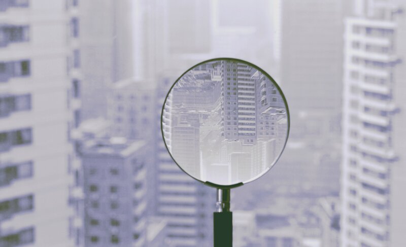 Magnifying Glass over City