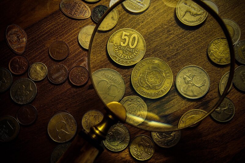 Magnifying Glass over Coins