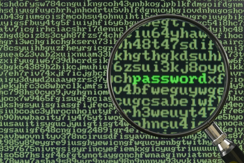magnifying glass over digital code