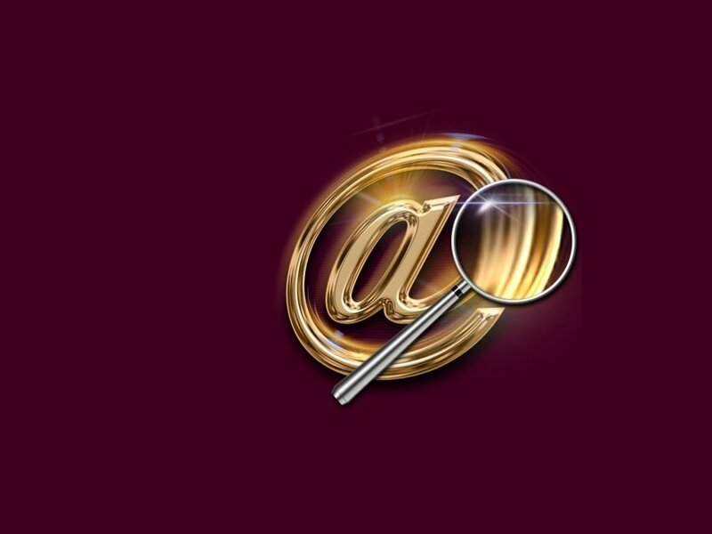 magnifying glass over golden at symbol