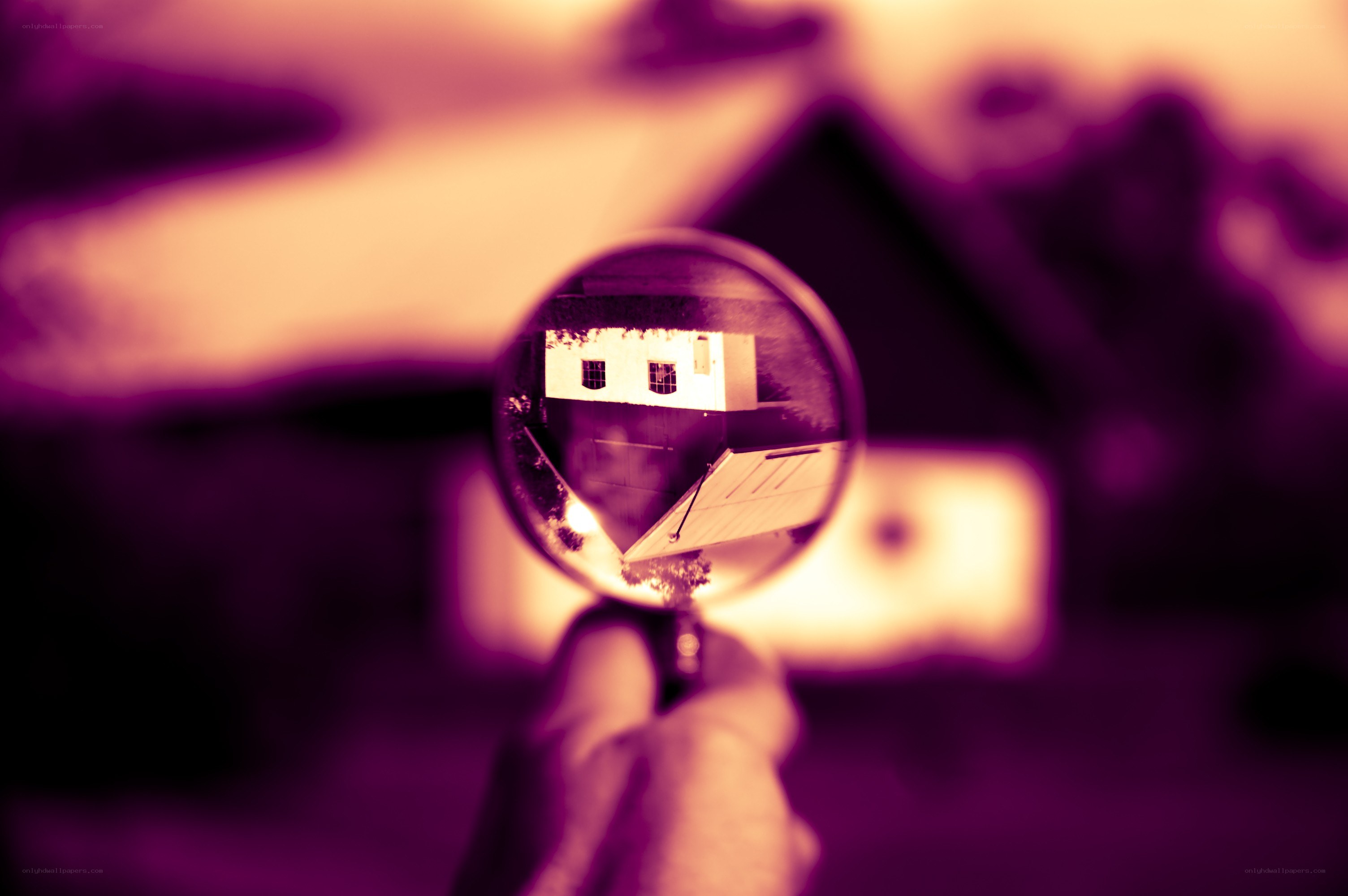 magnifying glass over house