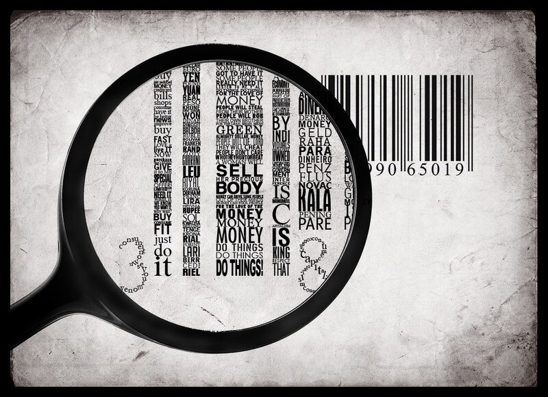 magnifying glass over money text