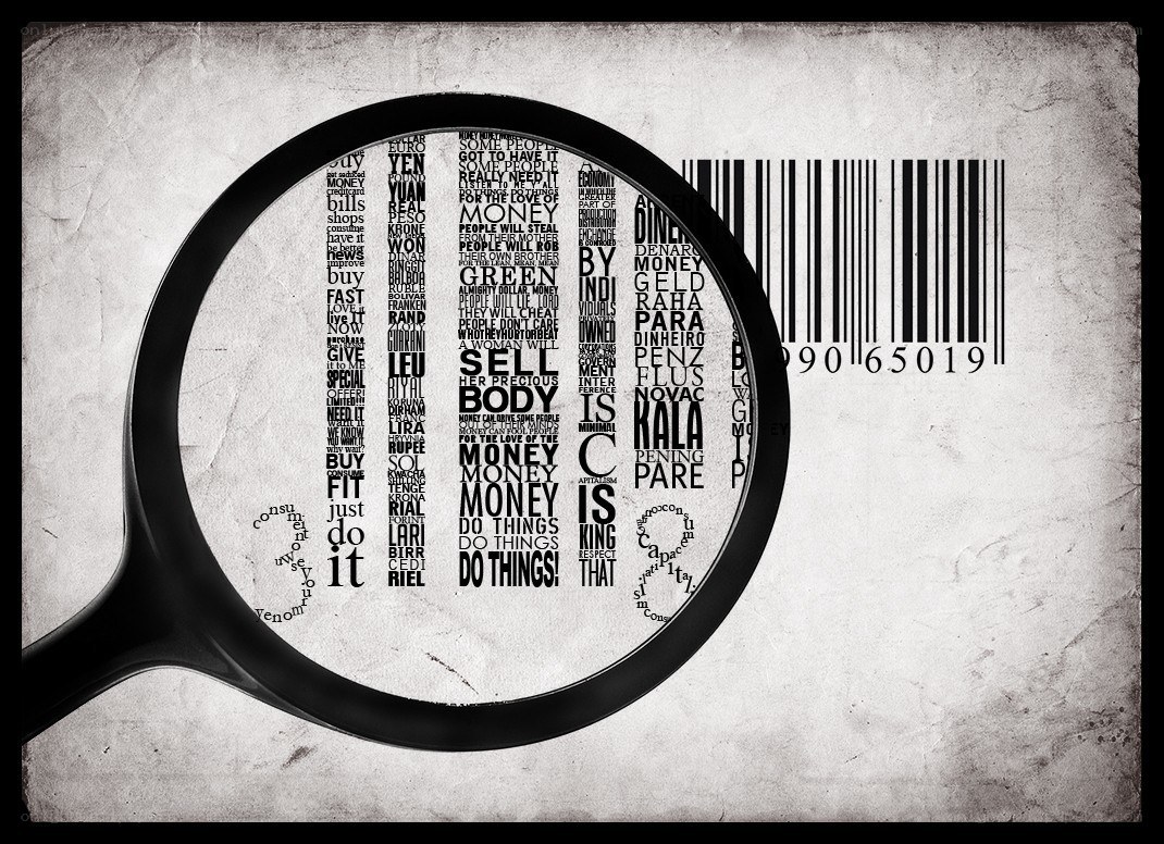 magnifying glass over money text