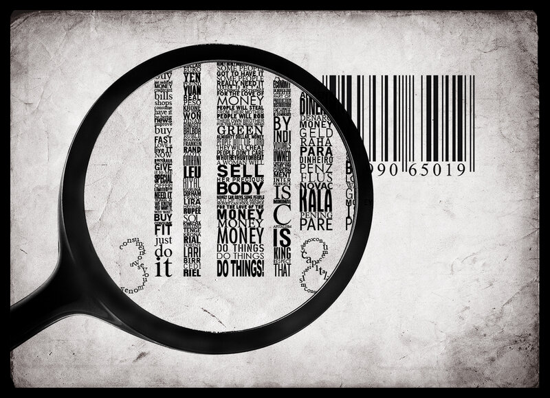 magnifying glass over money text