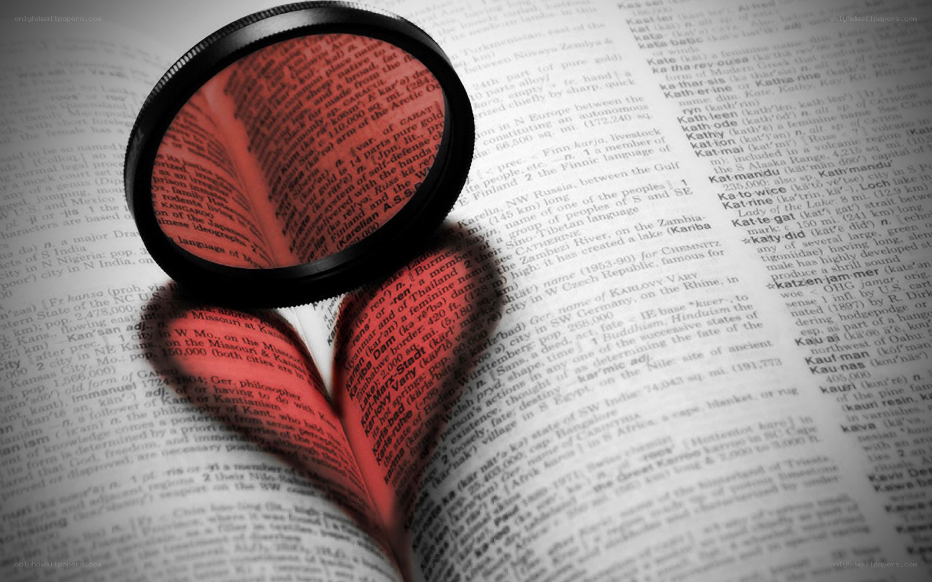 magnifying glass over open book