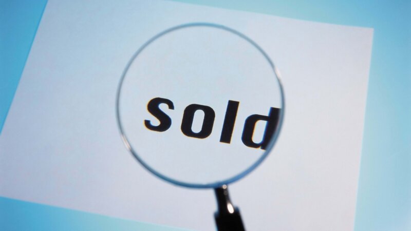 magnifying glass over sold text