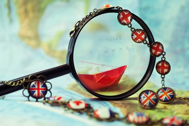 Magnifying Glass with Paper Boat