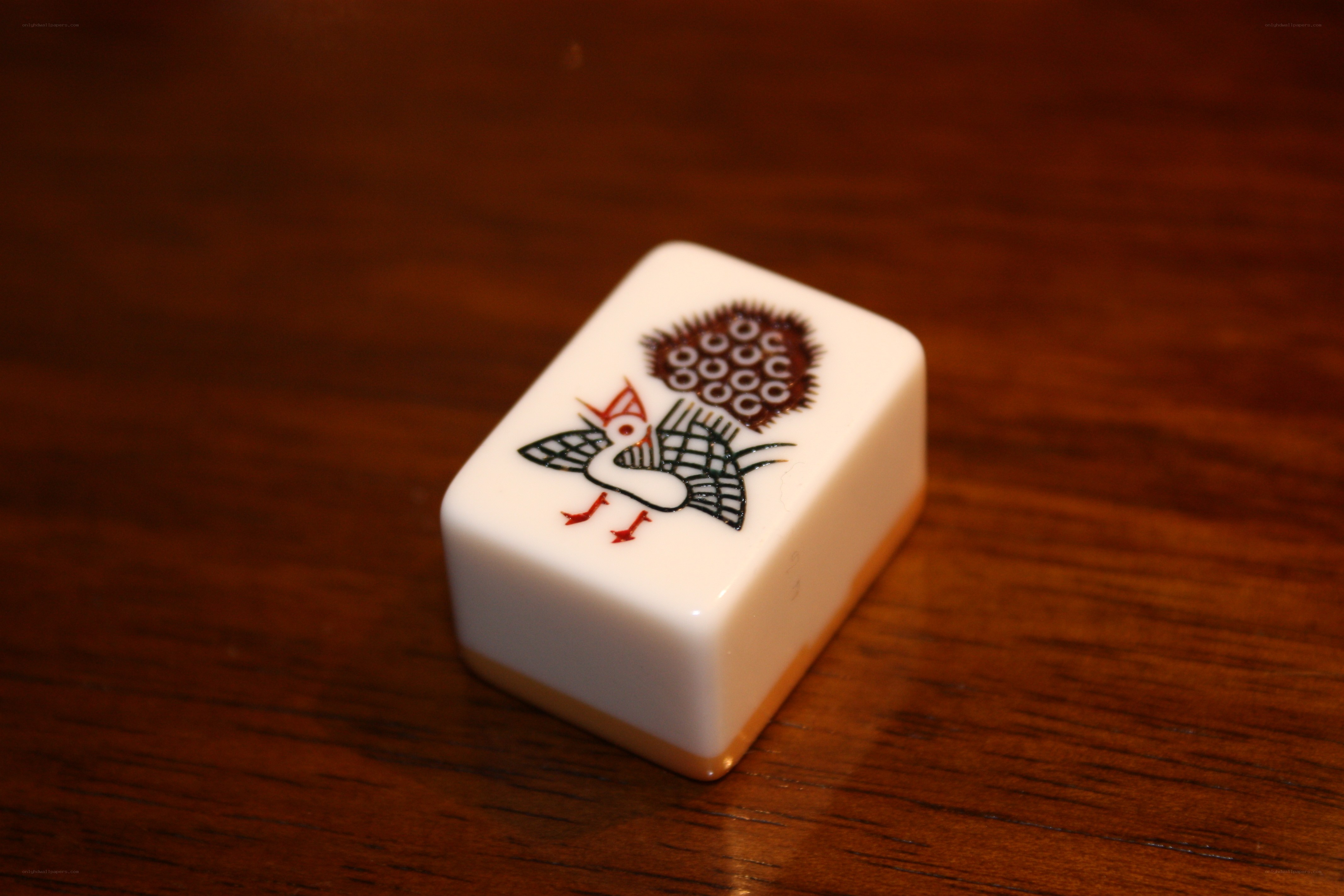 Mahjong tile with bird design