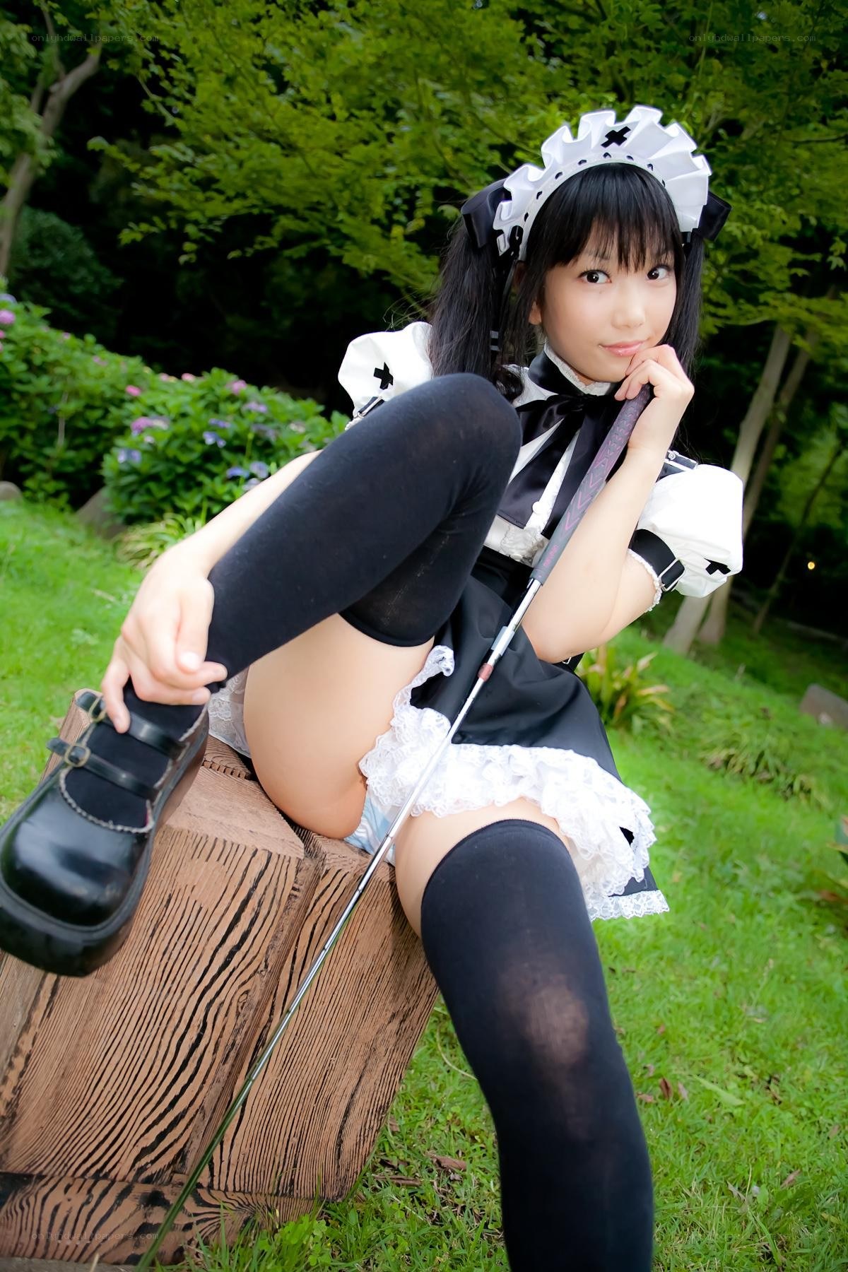 maid cosplayer in garden