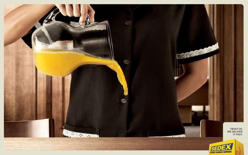 maid pouring orange juice
