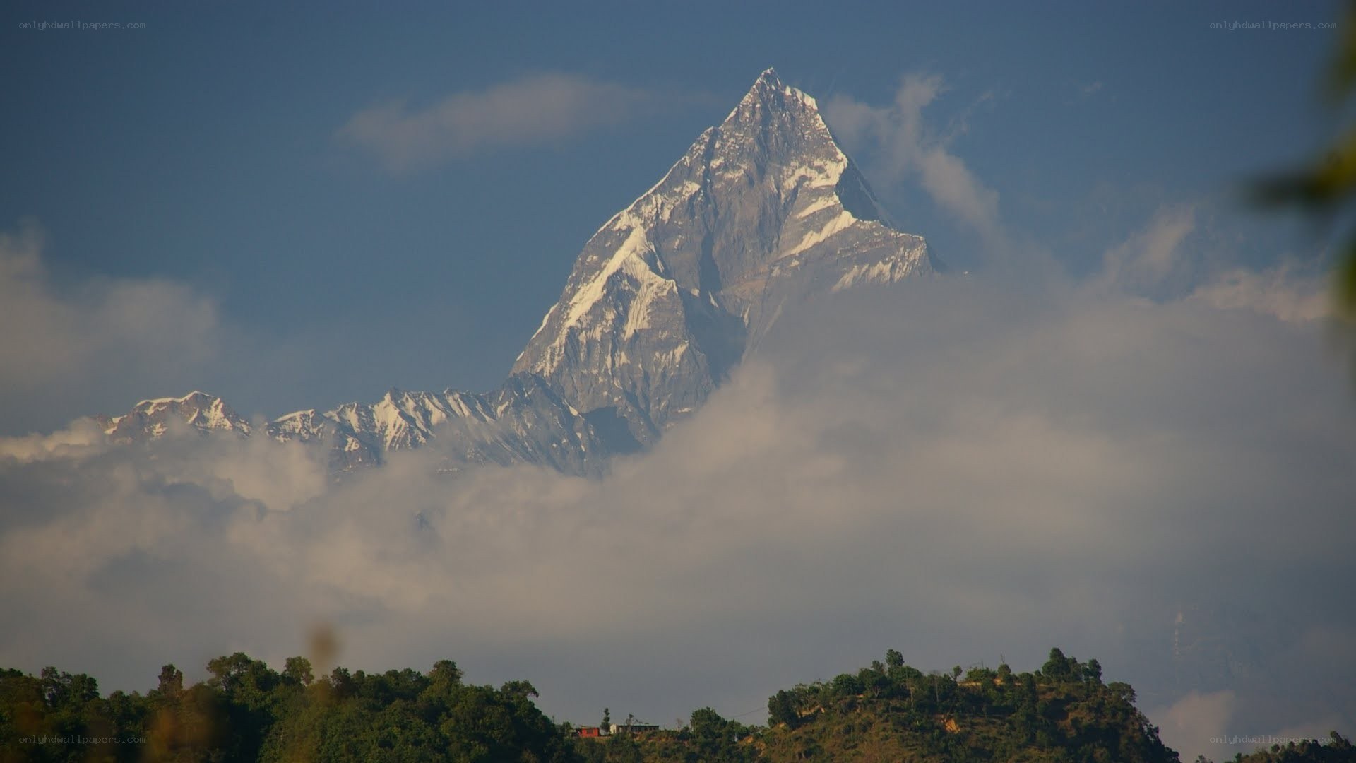 Majestic mountain peak above clouds