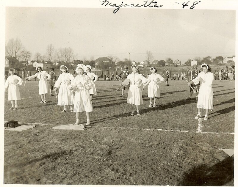 Majorettes performing on field