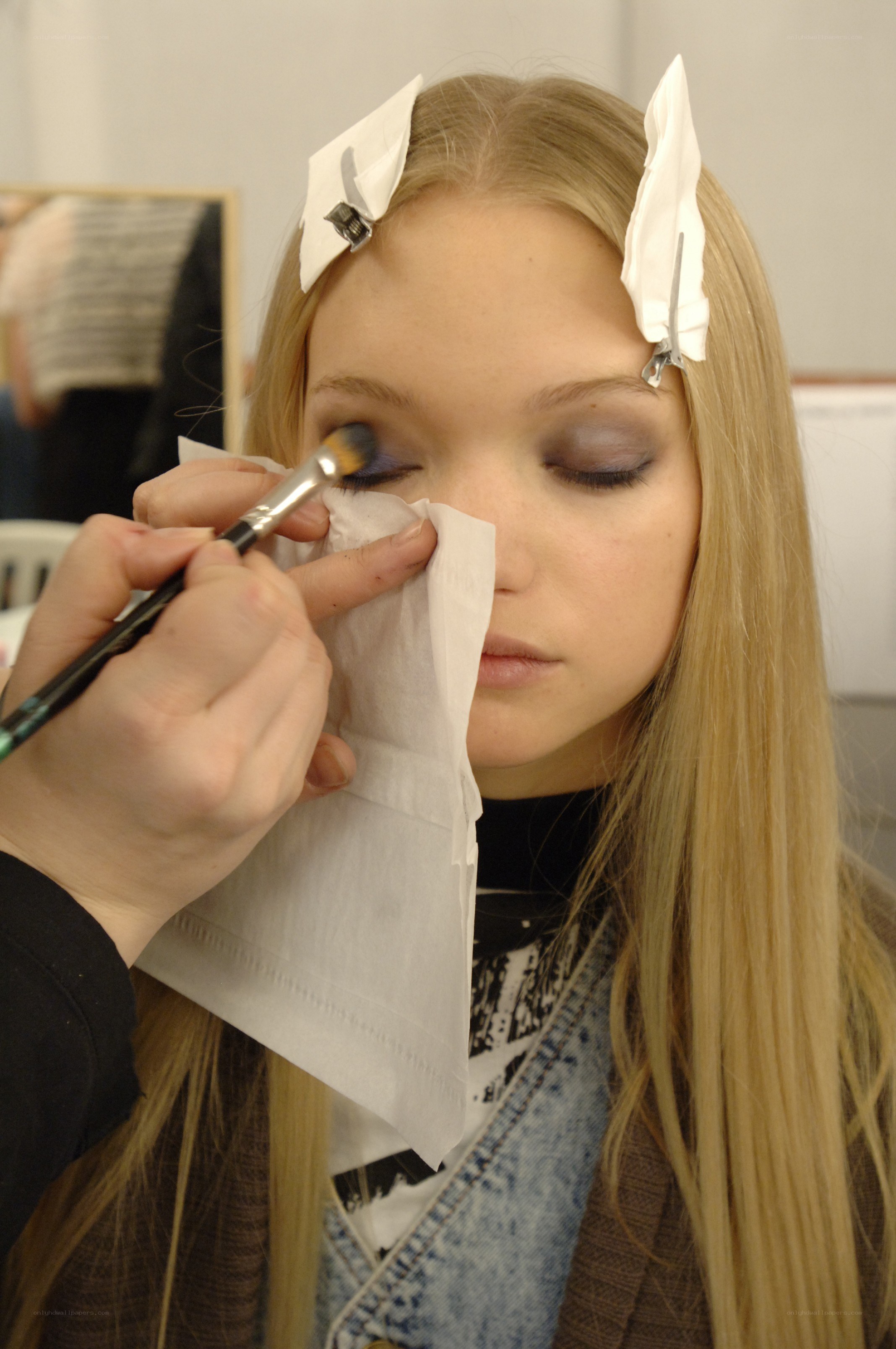 makeup artist applying eyeshadow