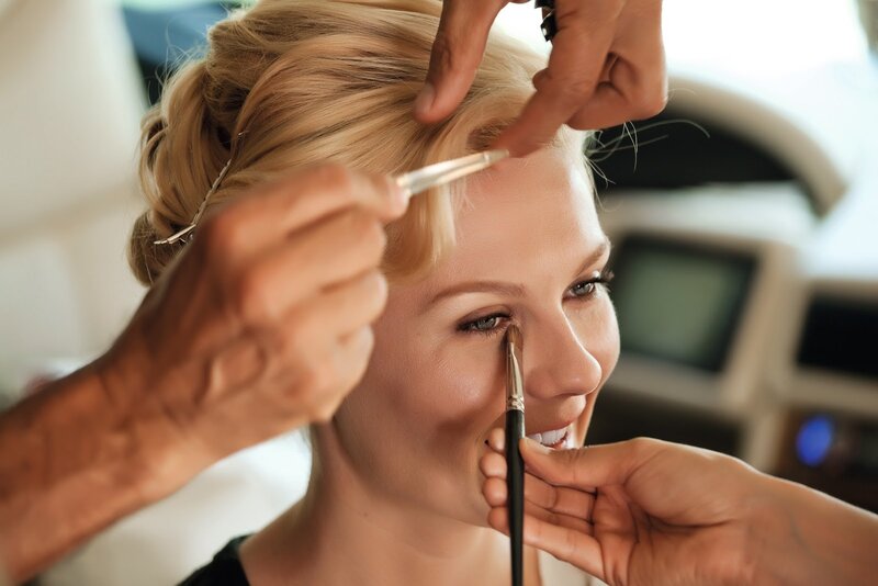 makeup artist applying makeup