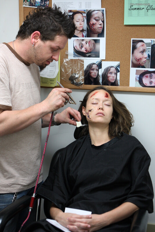 Makeup artist applying special effects