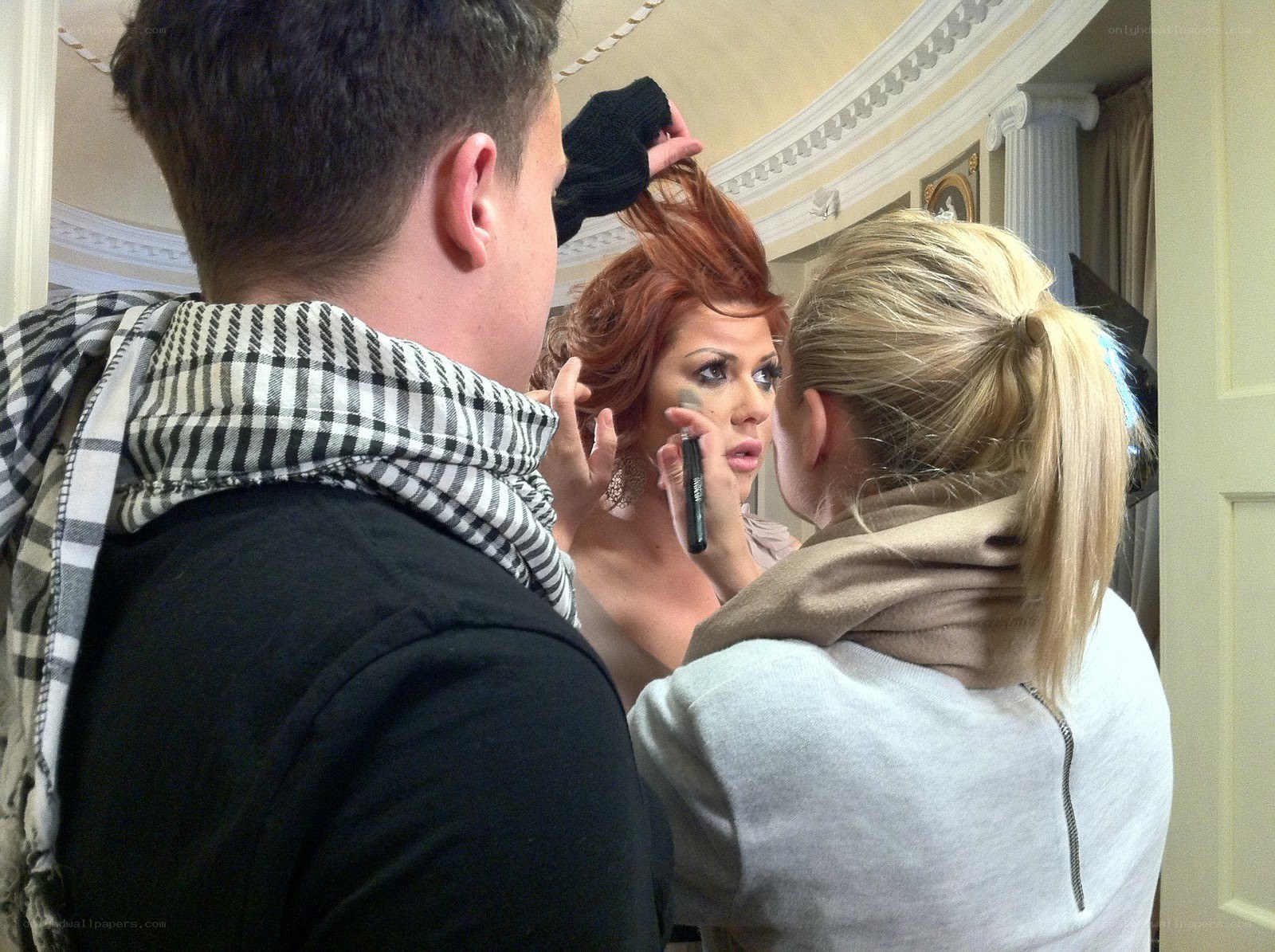 Makeup artist working on a model