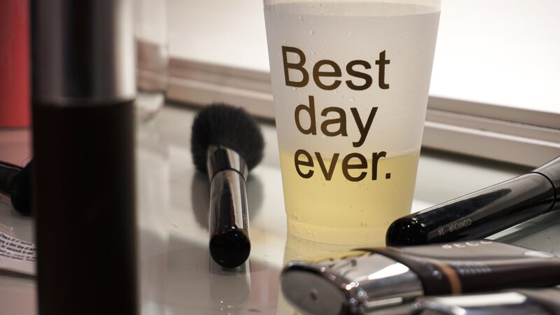 Makeup tools and cup with text