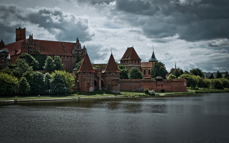 Malbork Castle under stormy sky