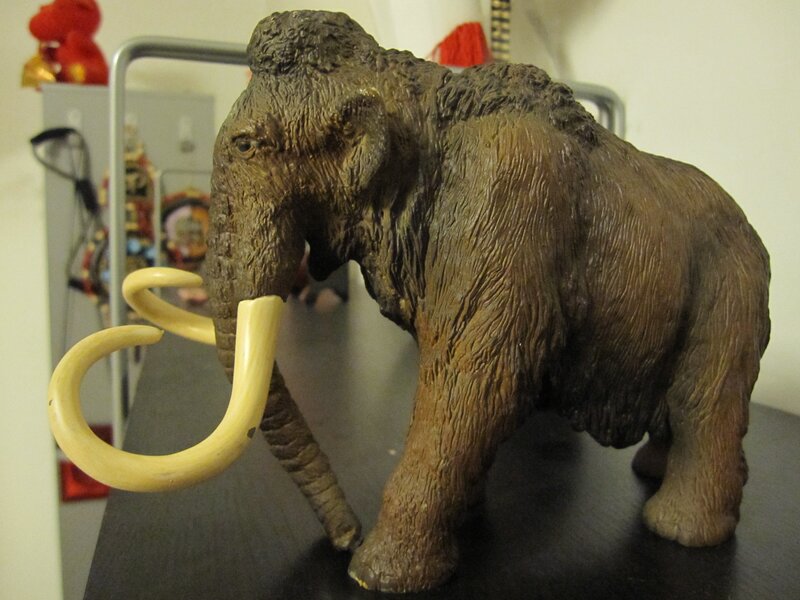 Mammoth figurine on table