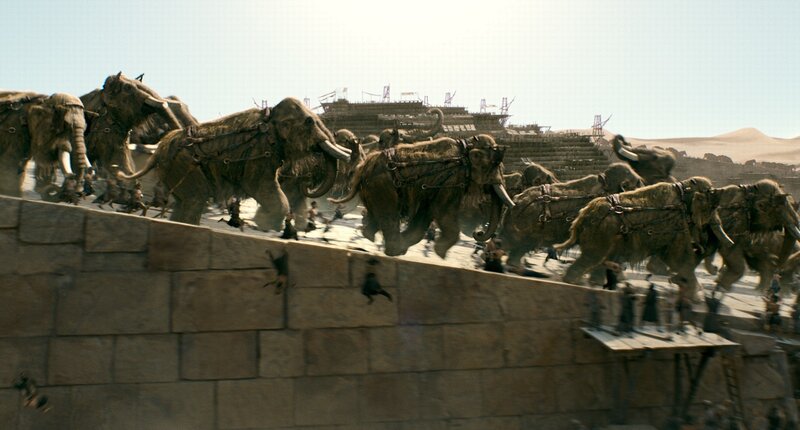 Mammoths attacking a city