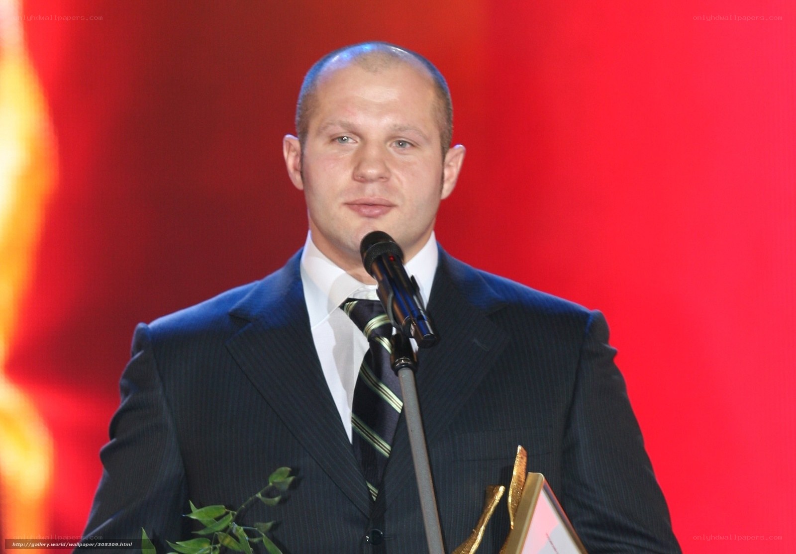 man accepting award on stage