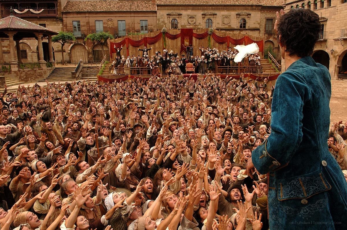 Man addressing a crowd in historical setting