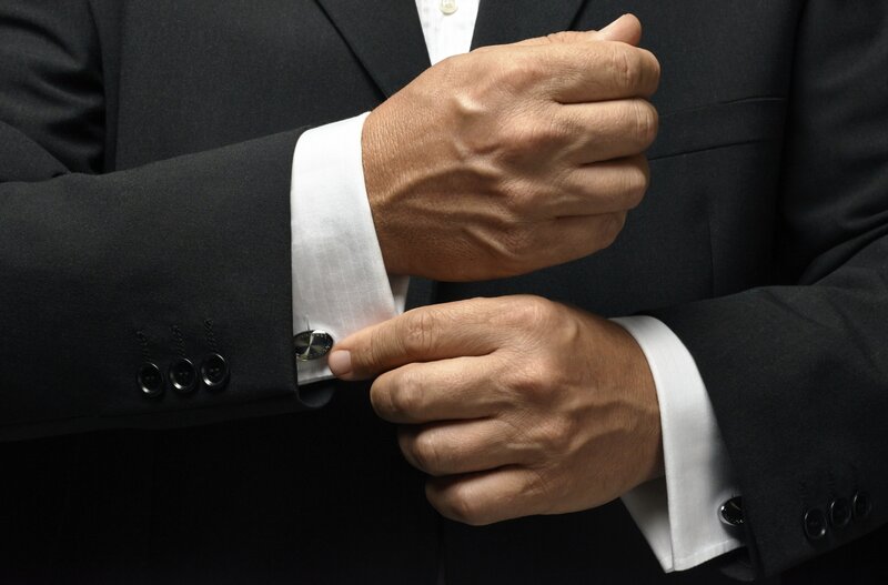 Man Adjusting Cufflinks