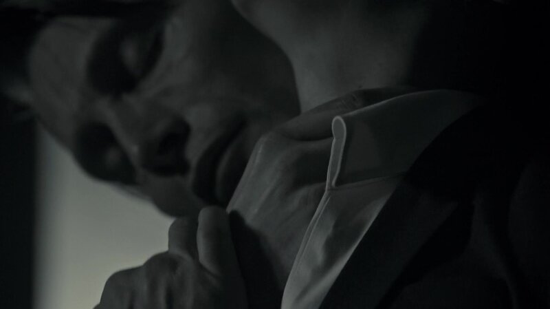 man adjusting his collar