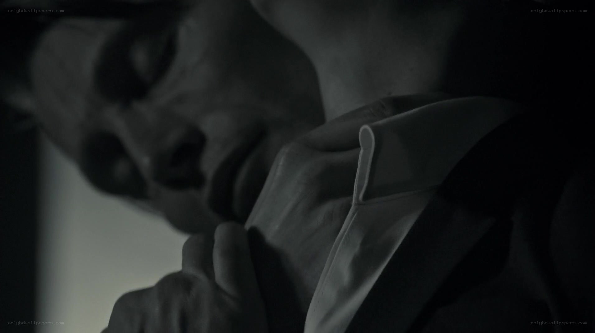 man adjusting his collar