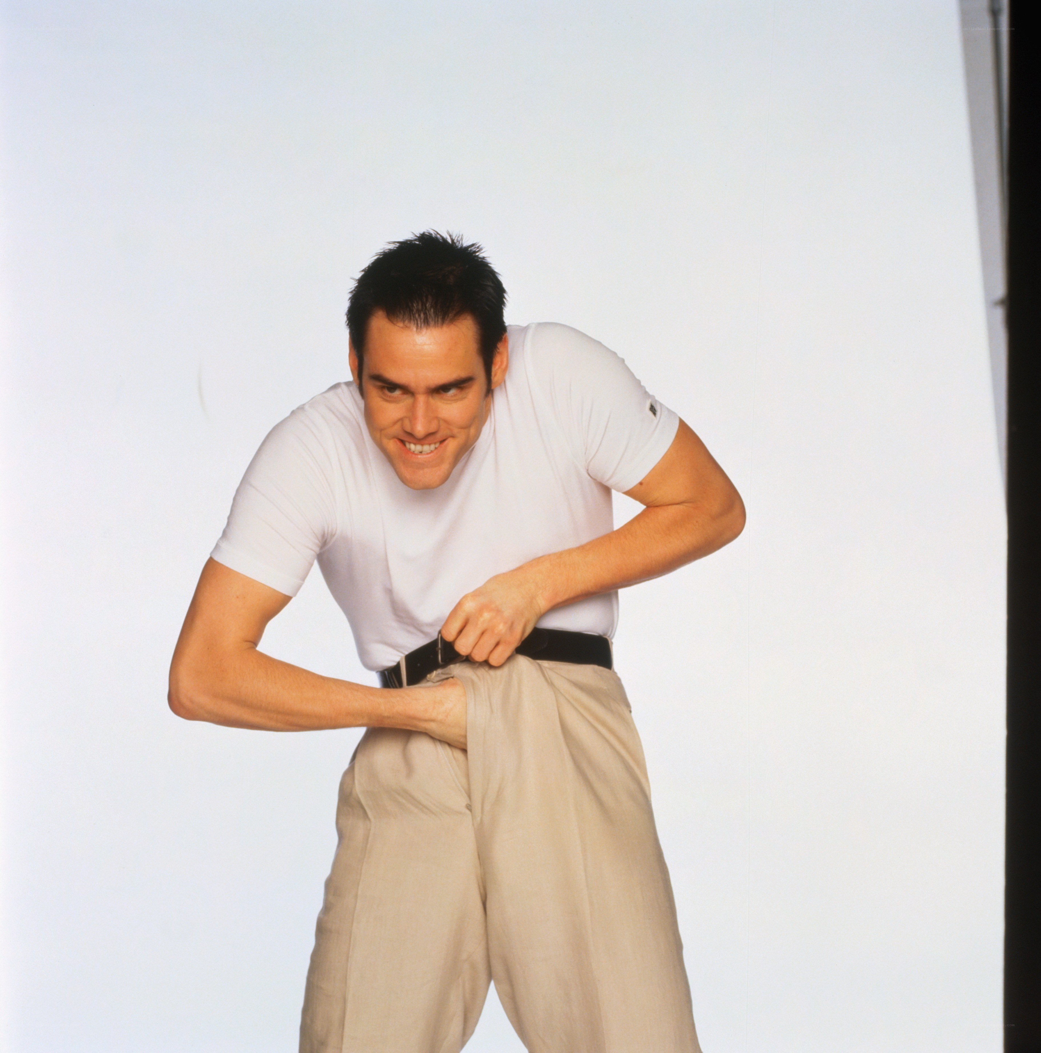 man adjusting his pants