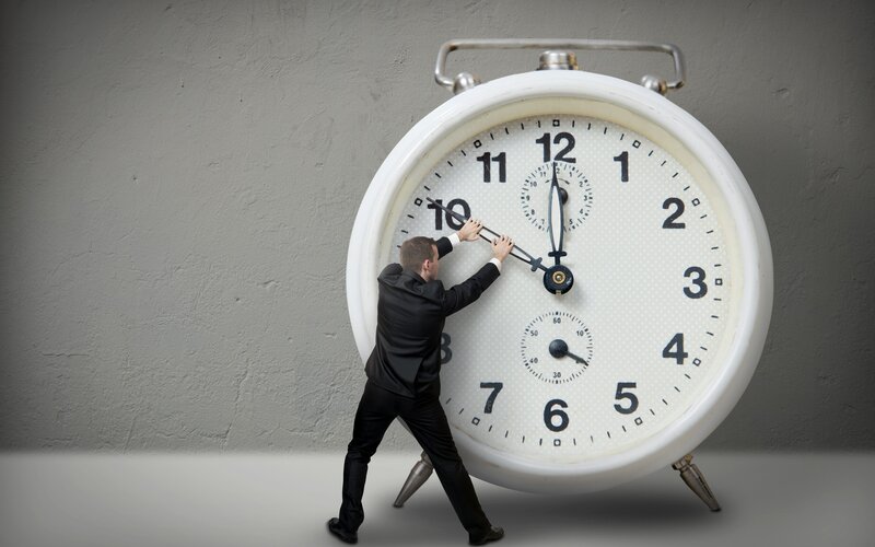 Man Adjusting Large Clock