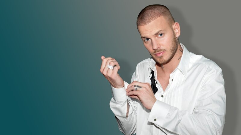 man adjusting shirt cuff