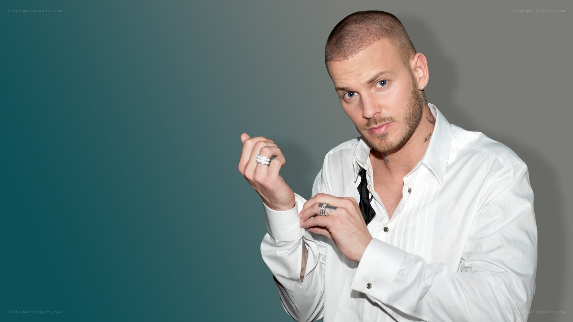man adjusting shirt cuff