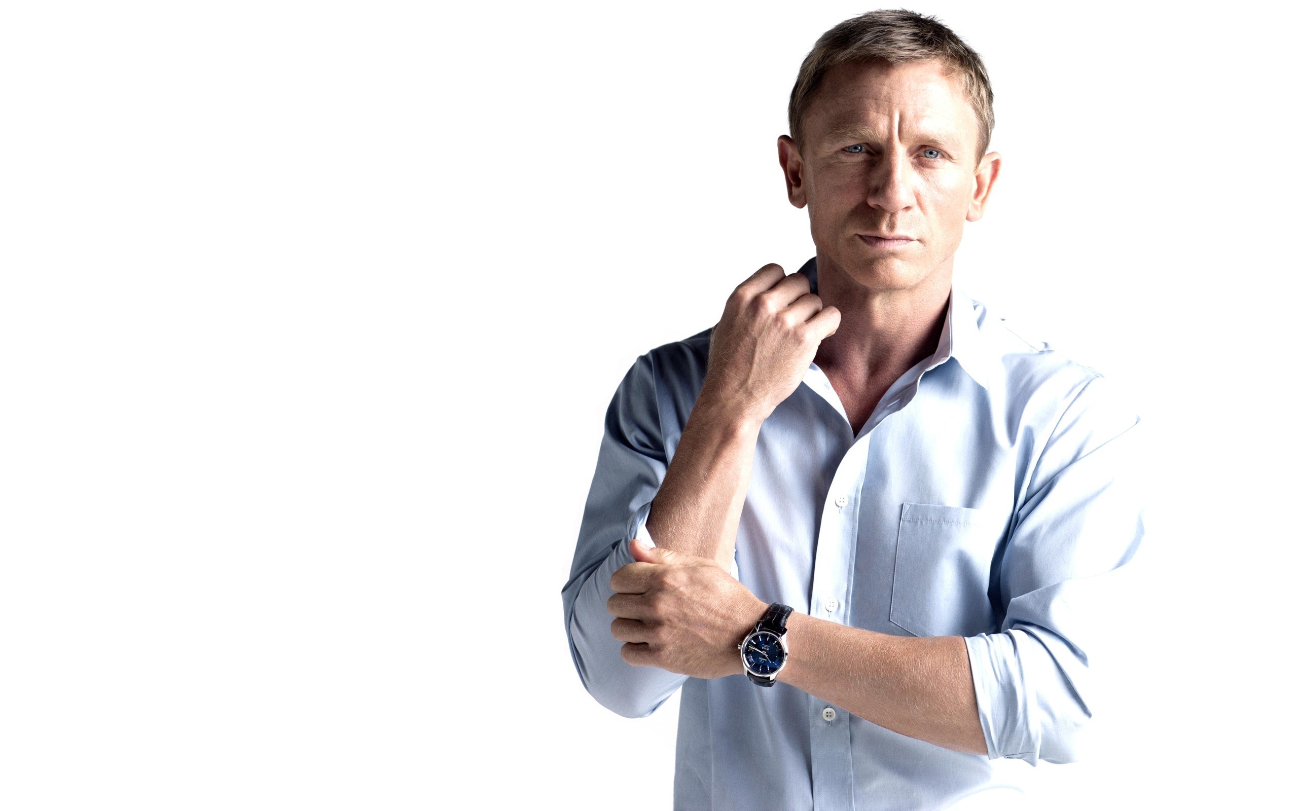 man adjusting shirt sleeve