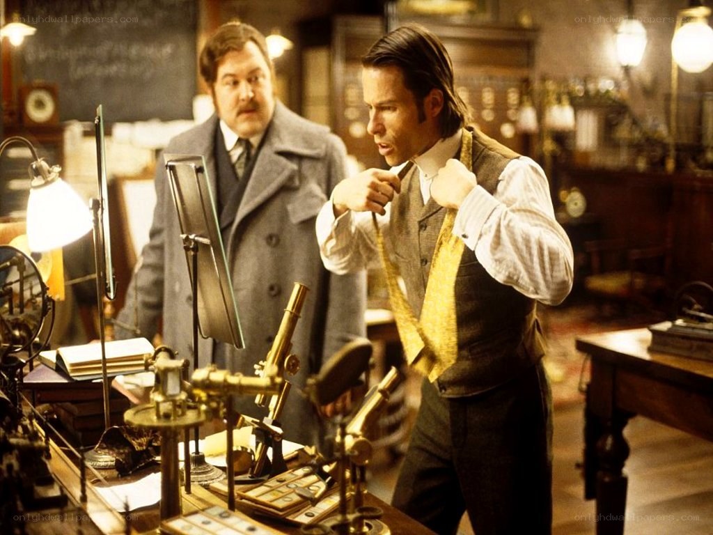 man adjusting tie in lab