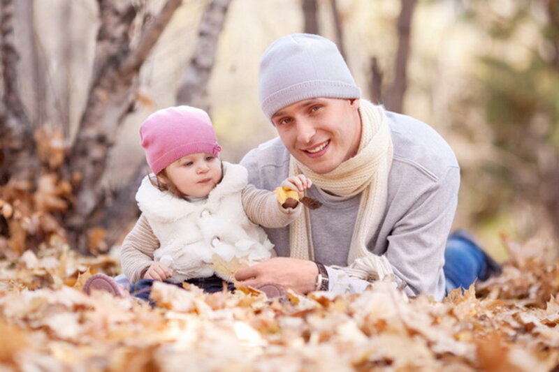 Man and Baby in Leaves