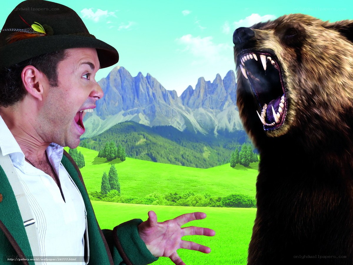 Man and bear in mountain landscape
