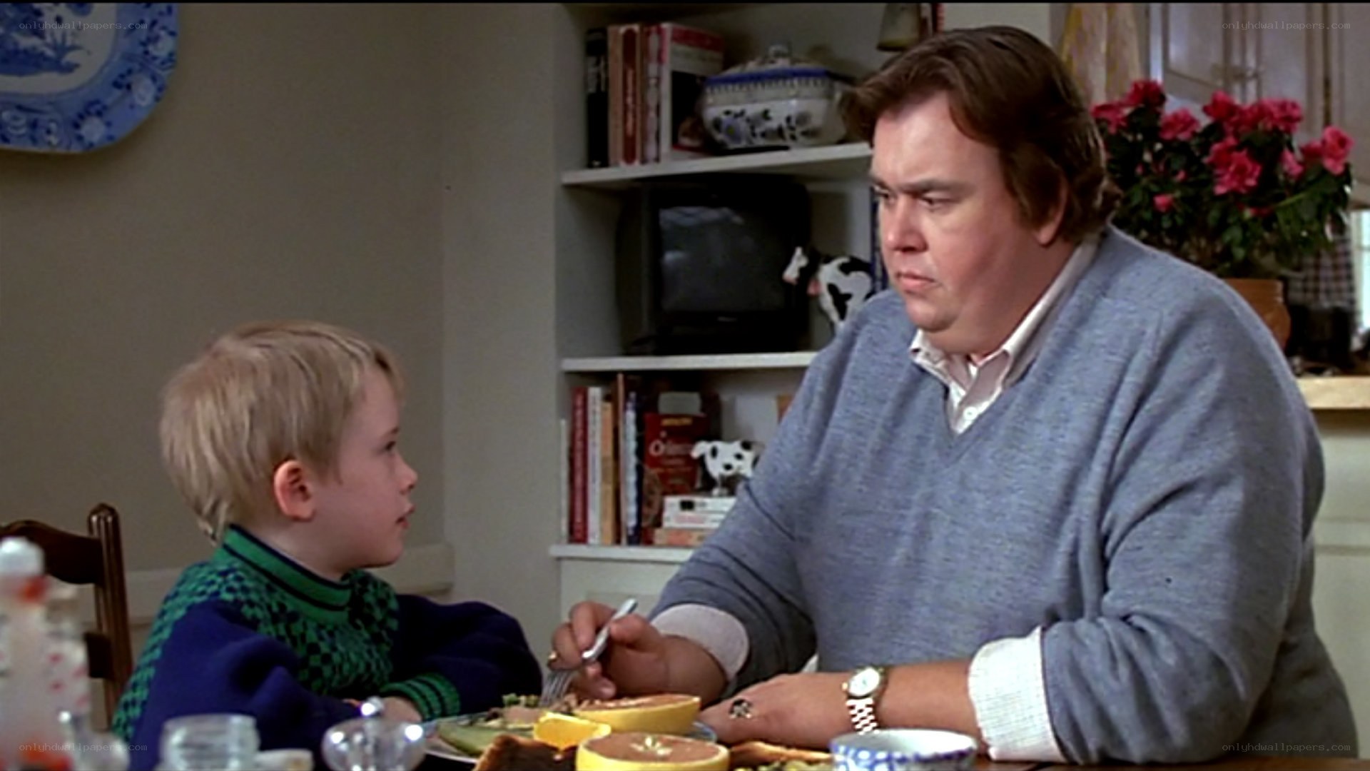 man and boy at breakfast table