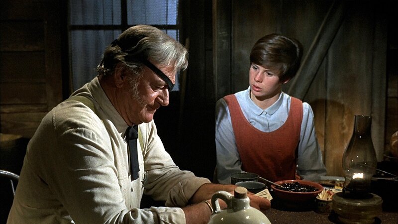 man and boy at table
