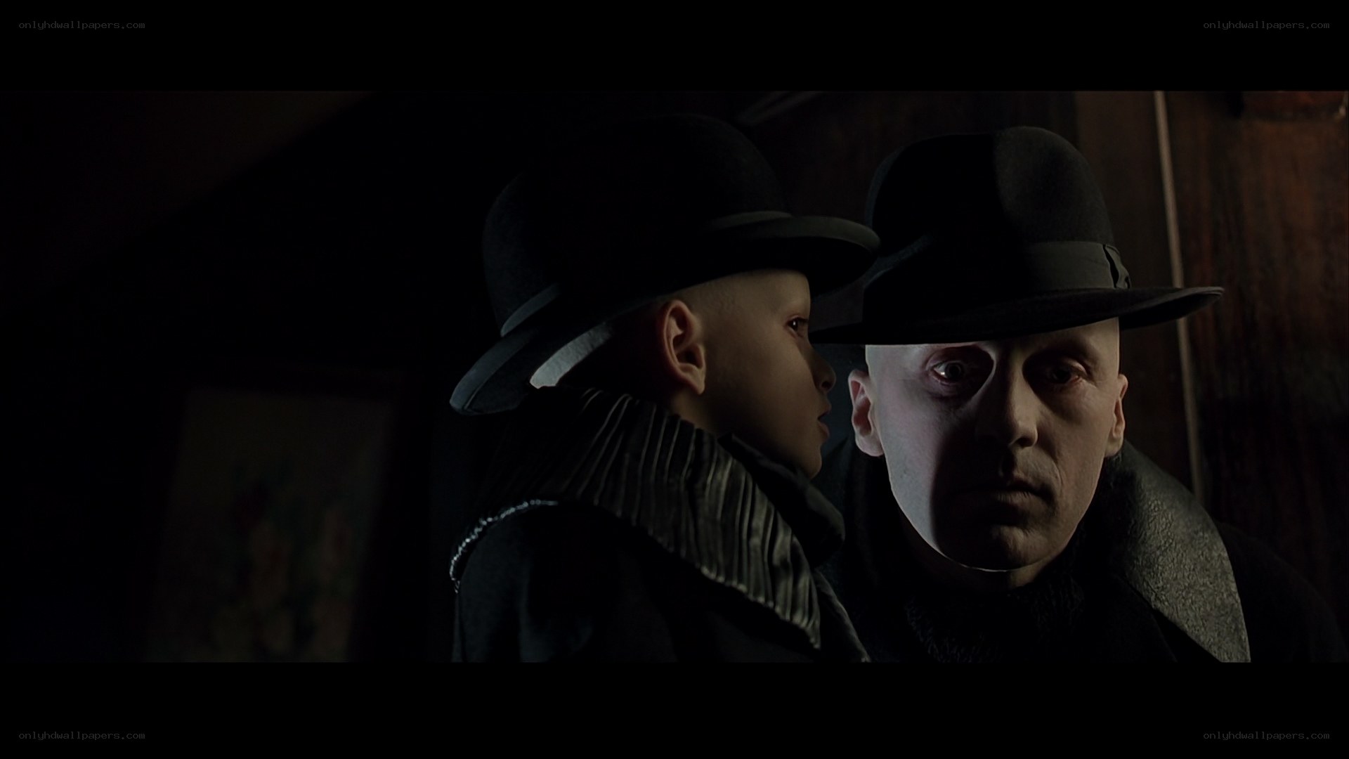man and boy in dark hats