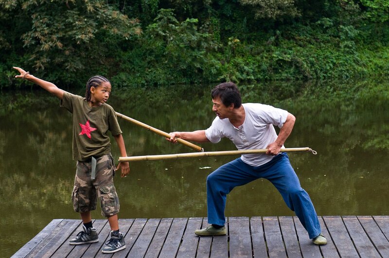 Man and boy practicing martial arts