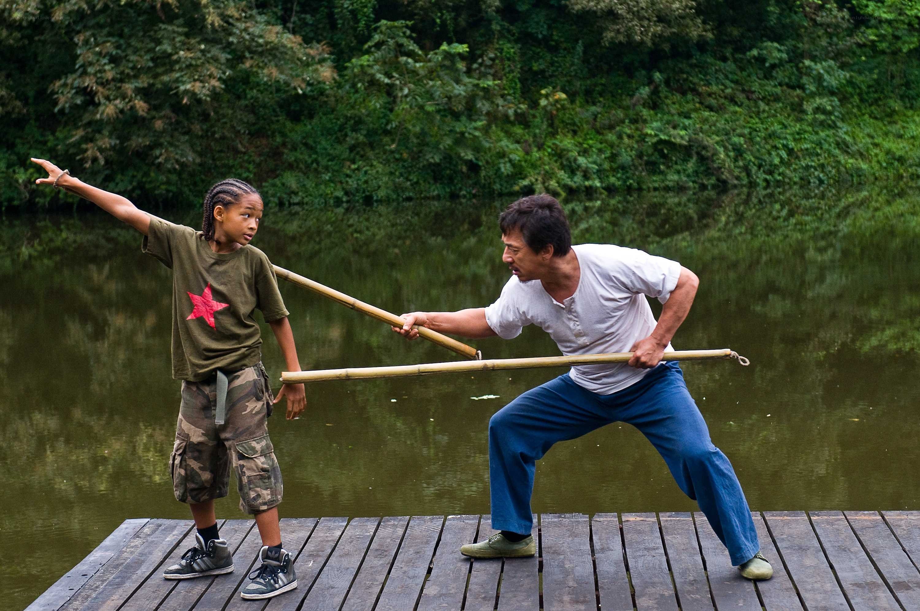 Man and boy practicing martial arts