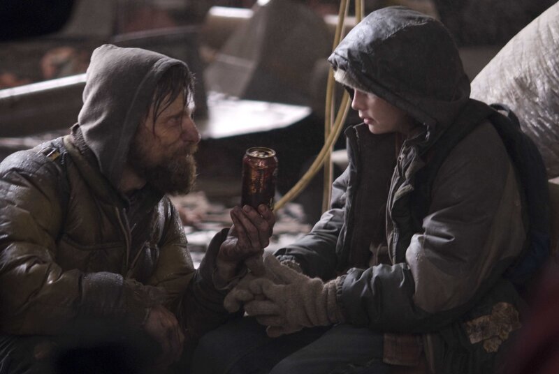 man and boy sharing a can