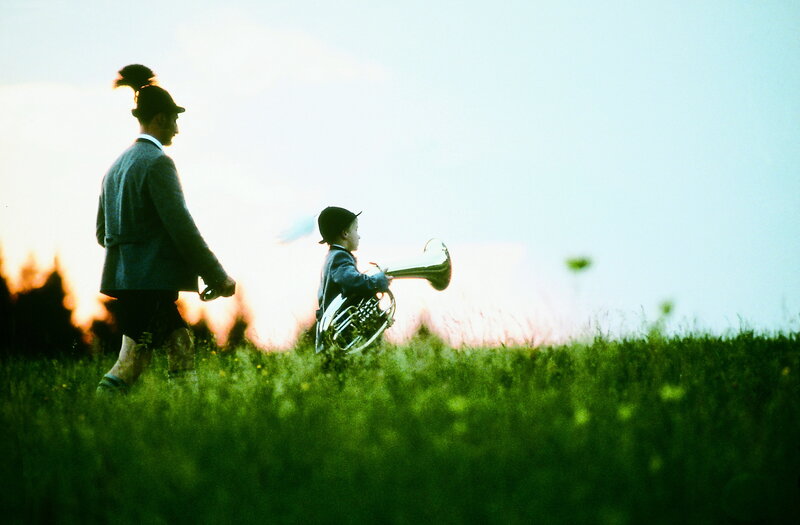 Man and boy with brass instrument